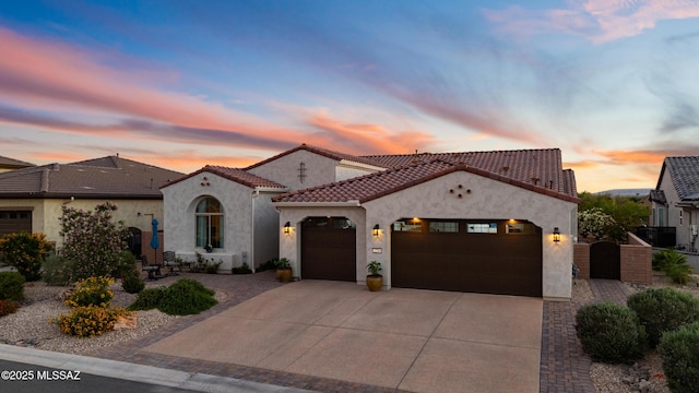 2230 E Thunder Bluff Dr, Green Valley, AZ 85614 - mediterranean / spanish-style house with an attached garage, driveway, a gate, stucco siding, and a tiled roof