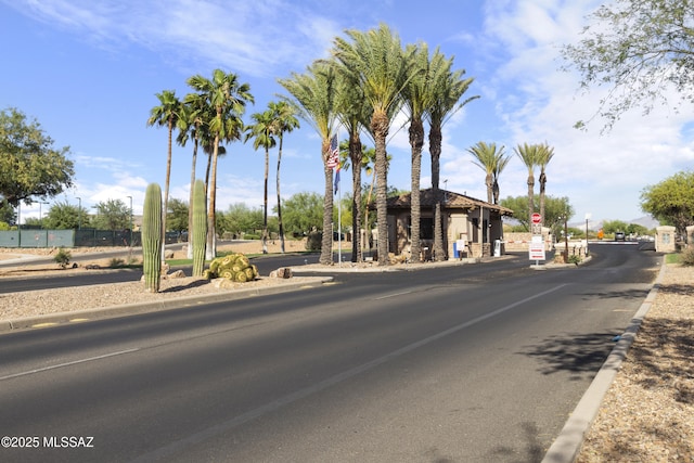 2230 E Thunder Bluff Dr, Green Valley, AZ 85614 - view of asphalt road with traffic signs and curbs