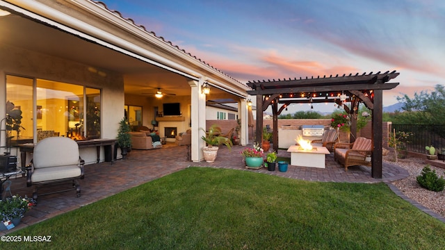2230 E Thunder Bluff Dr, Green Valley, AZ 85614 - view of yard featuring a patio, exterior kitchen, an outdoor living space with a fireplace, a pergola, and ceiling fan