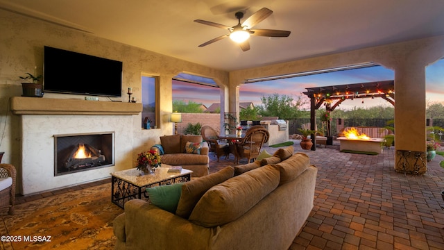 2230 E Thunder Bluff Dr, Green Valley, AZ 85614 - fenced backyard featuring a patio area and an outdoor living space with a fireplace