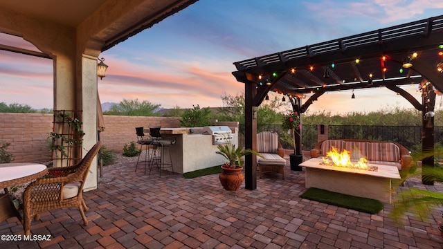 2230 E Thunder Bluff Dr, Green Valley, AZ 85614 - view of patio with a fire pit, an outdoor bar, a pergola, and outdoor dining space