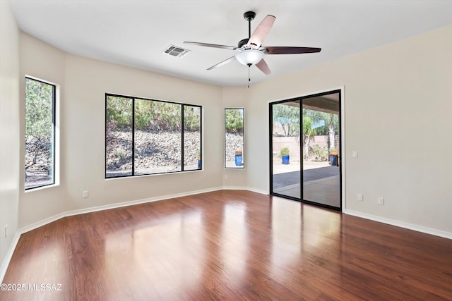 4706 W Cholla Bluff Dr, Marana, AZ 85658 - spare room with ceiling fan, wood finished floors, and baseboards