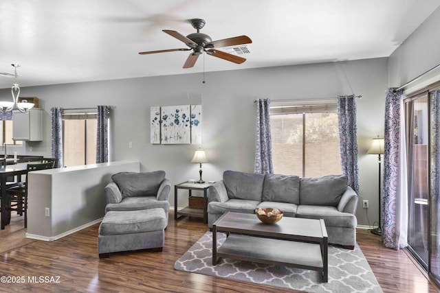 14472 S Camino Tierra Monte, Sahuarita, AZ 85629 - living area featuring wood finished floors, ceiling fan, baseboards, and a chandelier