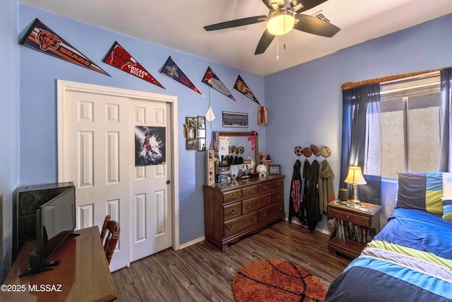 14472 S Camino Tierra Monte, Sahuarita, AZ 85629 - bedroom featuring wood finished floors, baseboards, ceiling fan, and a closet