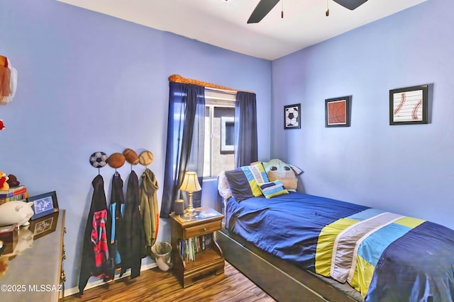 14472 S Camino Tierra Monte, Sahuarita, AZ 85629 - bedroom with wood finished floors, a ceiling fan, and baseboards