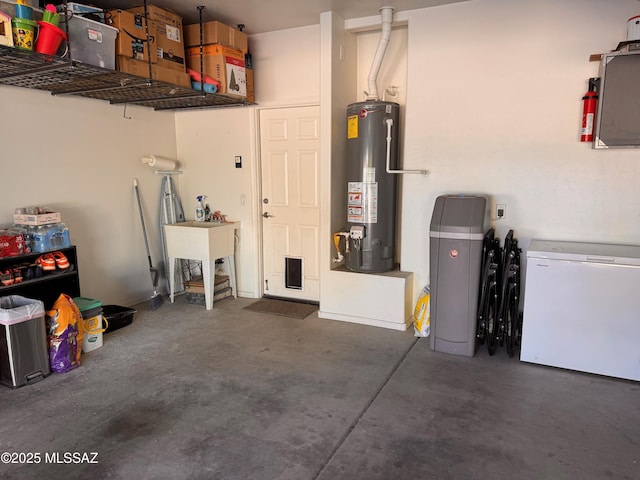 garage featuring white fridge and water heater