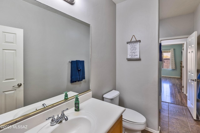 14472 S Camino Tierra Monte, Sahuarita, AZ 85629 - bathroom featuring toilet, baseboards, and vanity