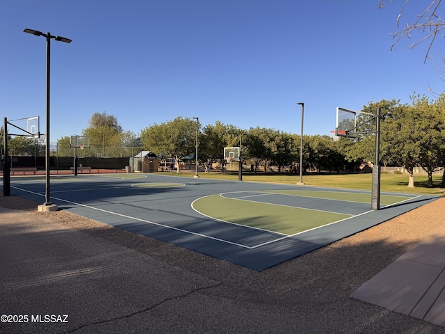 view of basketball court featuring a storage unit and community basketball court
