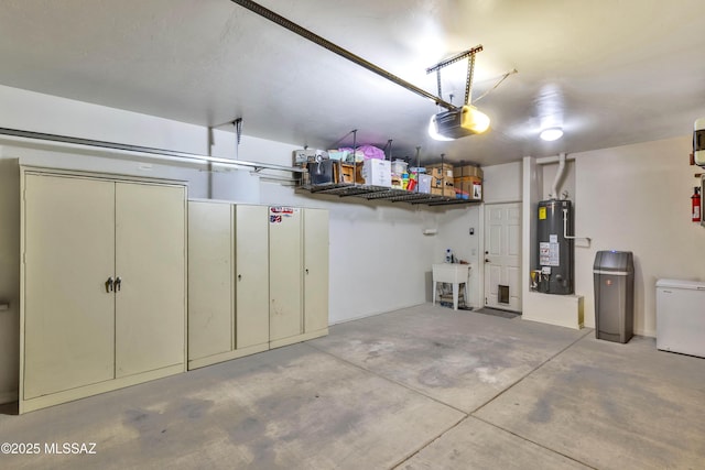 14472 S Camino Tierra Monte, Sahuarita, AZ 85629 - garage featuring gas water heater, a garage door opener, and refrigerator
