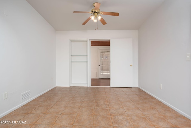 5930 E 32nd St, Tucson, AZ 85711 - unfurnished bedroom featuring a ceiling fan, visible vents, and baseboards