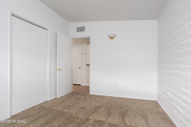 5930 E 32nd St, Tucson, AZ 85711 - unfurnished bedroom featuring visible vents and carpet floors