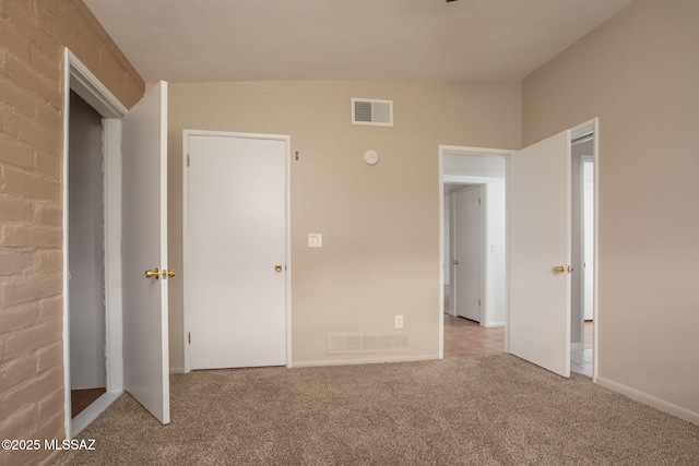 5930 E 32nd St, Tucson, AZ 85711 - unfurnished bedroom featuring visible vents, carpet, and baseboards