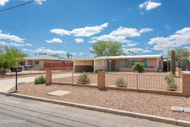 5930 E 32nd St, Tucson, AZ 85711 - single story home featuring a fenced front yard and concrete driveway