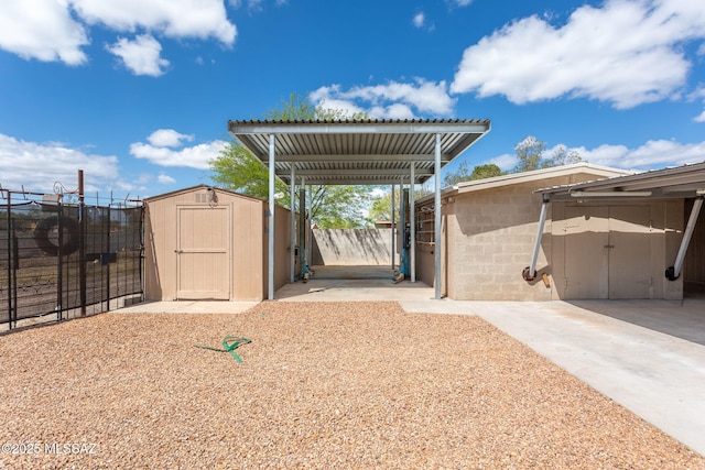 5930 E 32nd St, Tucson, AZ 85711 - view of patio with an outbuilding, a storage shed, and fence