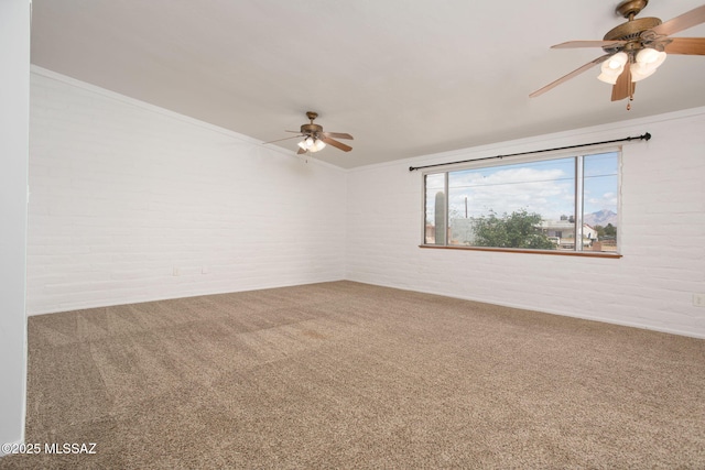 5930 E 32nd St, Tucson, AZ 85711 - carpeted spare room featuring ceiling fan, brick wall, and crown molding