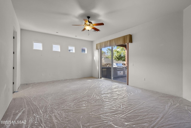 unfurnished room featuring ceiling fan