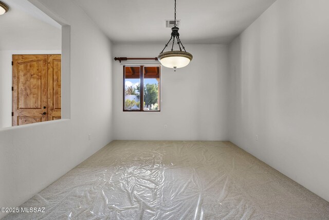 empty room featuring carpet floors