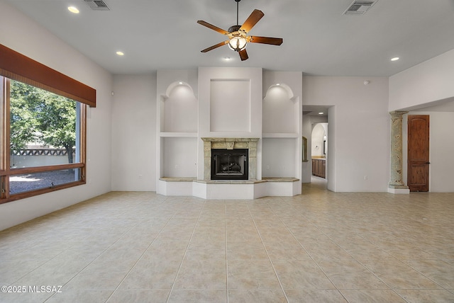 unfurnished living room featuring a ceiling fan, visible vents, light tile patterned floors, and recessed lighting