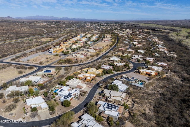 birds eye view of property featuring a mountain view and a residential view