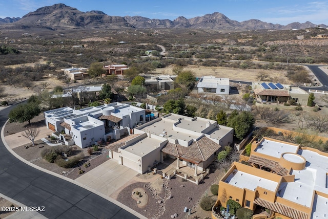 birds eye view of property with a residential view and a mountain view