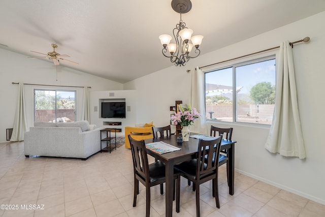 dining room featuring baseboards, light tile patterned floors, lofted ceiling, and ceiling fan with notable chandelier