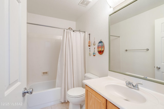 full bath featuring visible vents, tile patterned flooring, shower / tub combo, vanity, and toilet