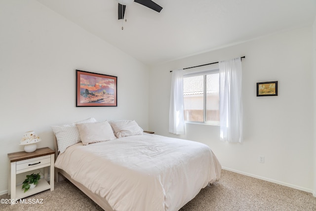 carpeted bedroom featuring baseboards, a ceiling fan, and lofted ceiling