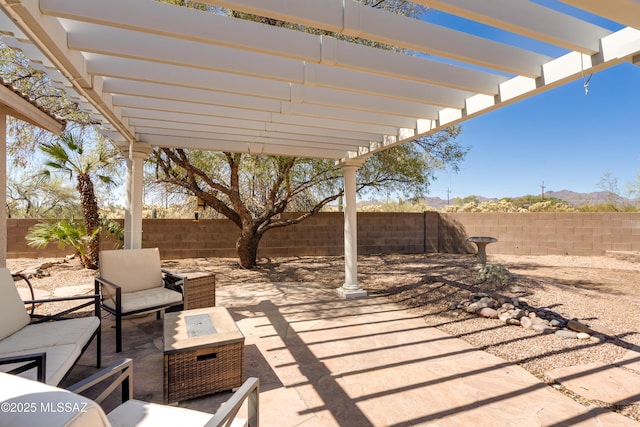 view of patio / terrace featuring a pergola, outdoor lounge area, and a fenced backyard