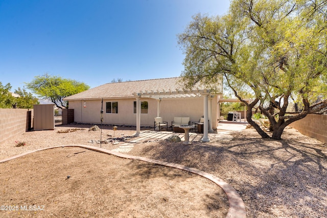 back of property featuring a tile roof, a patio area, a fenced backyard, a pergola, and outdoor lounge area