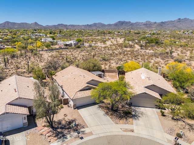 birds eye view of property with a residential view, a mountain view, and a desert view