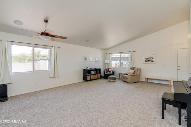 living room featuring carpet flooring, ceiling fan, and lofted ceiling