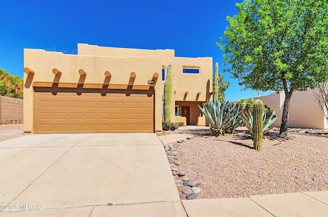 9290 N Jessy Ln, Tucson, AZ 85742 - adobe home with stucco siding, fence, driveway, and a garage