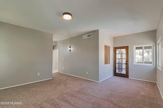 9290 N Jessy Ln, Tucson, AZ 85742 - spare room with visible vents, carpet, and baseboards