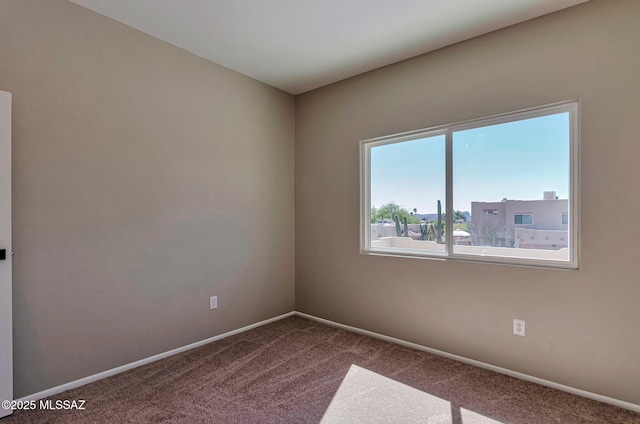 9290 N Jessy Ln, Tucson, AZ 85742 - unfurnished room featuring dark carpet and baseboards