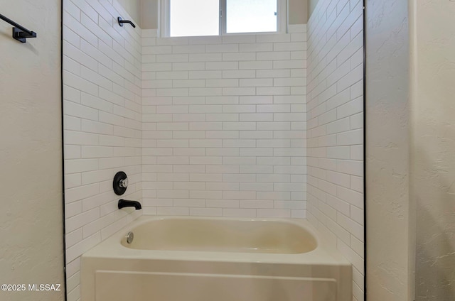 9290 N Jessy Ln, Tucson, AZ 85742 - bathroom featuring a textured wall and tub / shower combination