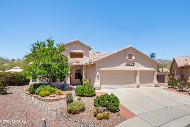 2377 W Catalina View Dr, Tucson, AZ 85742 - view of front facade with a garage, stucco siding, driveway, and a tiled roof