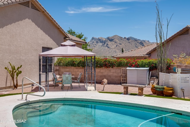 2377 W Catalina View Dr, Tucson, AZ 85742 - view of pool with a gazebo, a mountain view, fence, and a patio area