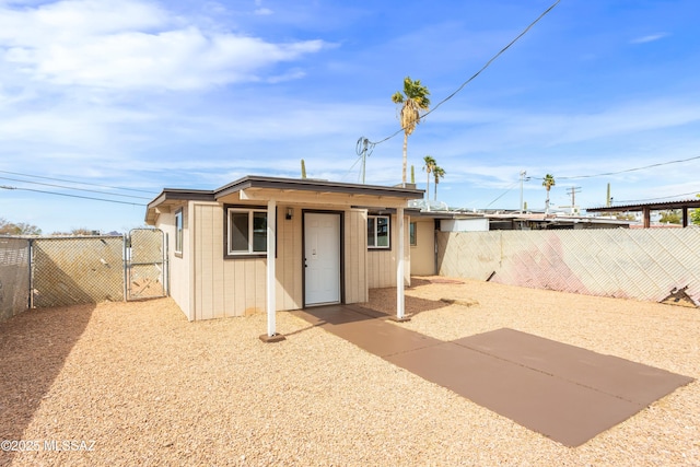 view of outdoor structure with a gate and fence private yard