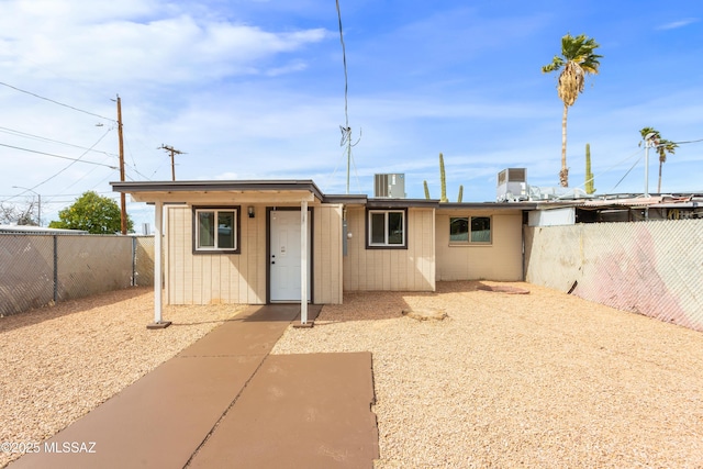 view of front of home featuring a fenced backyard
