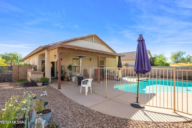 view of swimming pool with central AC, a fenced backyard, a fenced in pool, and a patio area
