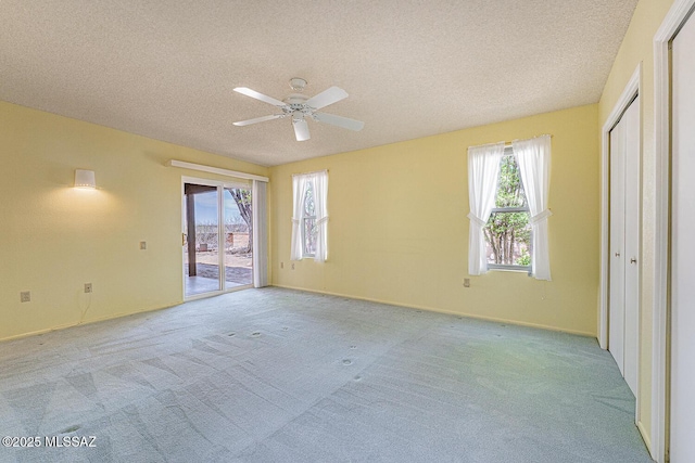 2778 S Via Del Bac, Green Valley, AZ 85622 - unfurnished room featuring a textured ceiling, plenty of natural light, and carpet flooring