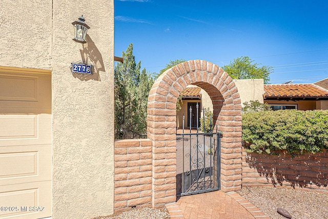 2778 S Via Del Bac, Green Valley, AZ 85622 - property entrance with stucco siding and a gate