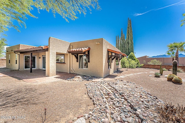2778 S Via Del Bac, Green Valley, AZ 85622 - back of house with fence, stucco siding, a tiled roof, and a patio area