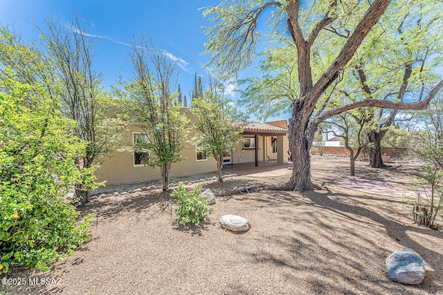 2778 S Via Del Bac, Green Valley, AZ 85622 - exterior space featuring stucco siding, a tiled roof, and a patio