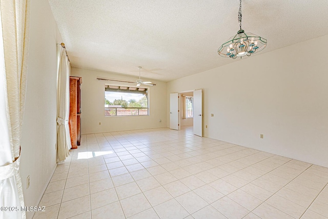 2778 S Via Del Bac, Green Valley, AZ 85622 - spare room with light tile patterned flooring, a textured ceiling, and an inviting chandelier