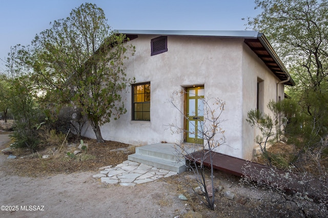 exterior space with stucco siding