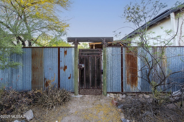 view of gate with fence