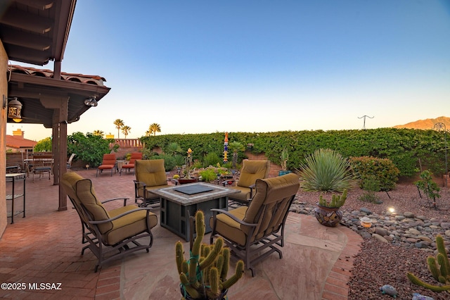 view of patio / terrace with fence and a fire pit