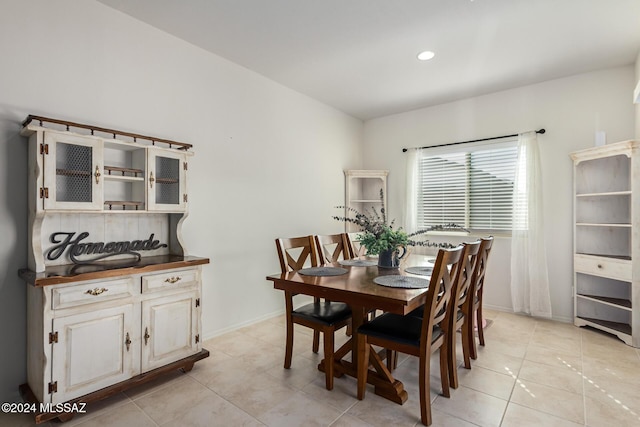 dining room with light tile patterned floors, recessed lighting, and baseboards
