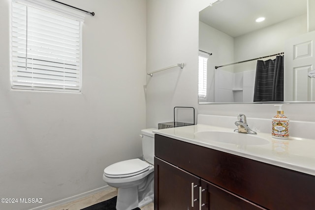 full bathroom with a shower with curtain, vanity, toilet, baseboards, and tile patterned flooring